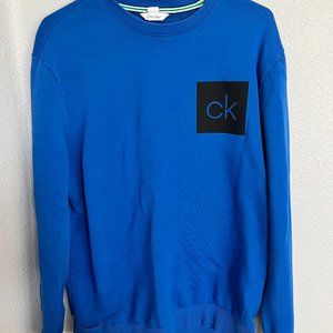 Royal Blue Calvin Klein Crewneck with brand initials on the left breast